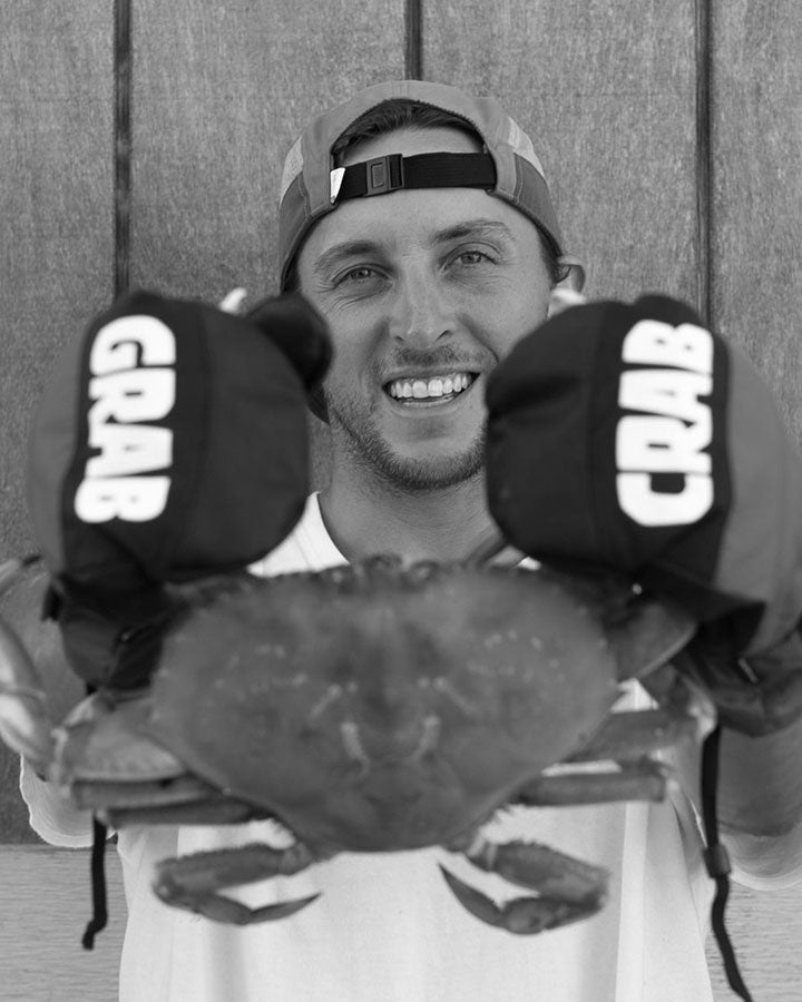 Team Rider Scott Stevens holding a crab with the Punch mitts